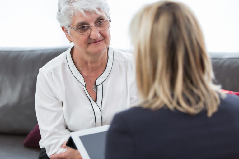 senior woman meeting with behavioral health provider